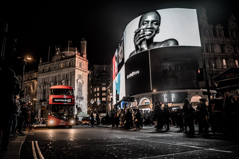 alt_text: "Dynamic digital marketing scene with Meta Ads on devices, UK landmarks, and Union Jack elements."